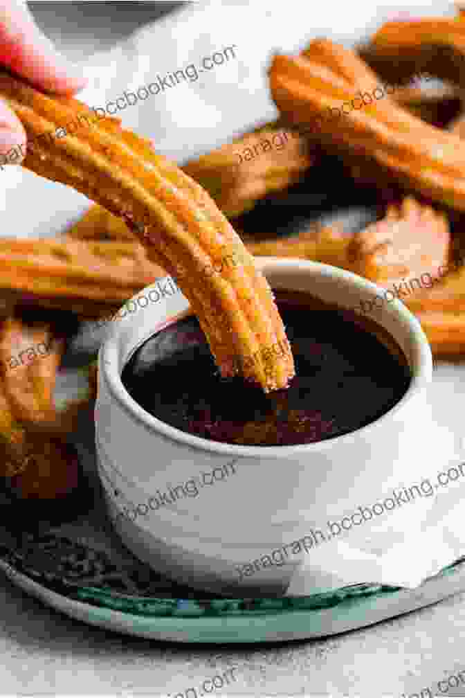 A Decadent Chocolate Churros, Dipped In A Warm And Thick Chocolate Sauce THE A TO Z OF THE RECIPE OF THE SPANISH LANGUAGE