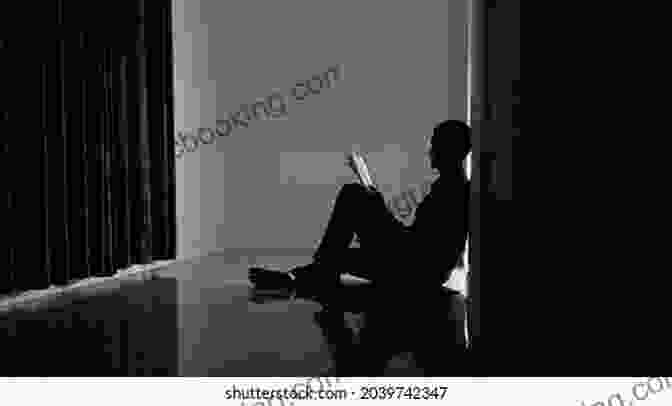 A Man Sitting Alone In A Dark Room, Contemplating The Psychological And Spiritual Challenges Of Rejecting Islam The Blasphemer: The Price I Paid For Rejecting Islam