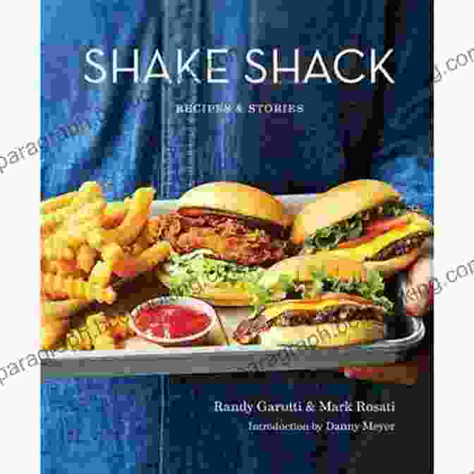An Image Of The Shake Shack Recipes Stories Cookbook Cover, Featuring A Vibrant Photo Of A Burger And Fries On A Blue Background. Shake Shack: Recipes Stories: A Cookbook