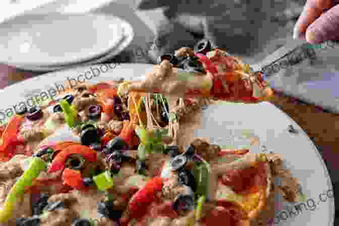 The Pizza Cookbook Cover Image, Featuring A Photo Of A Mouthwatering Pizza With Various Toppings. The Pizza Cookbook: 50+ Traditional And Innovative Pizza Recipes